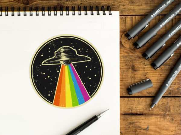 A sticker of an vintage-style UFO with a rainbow tractor beam