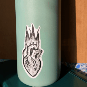 Vinyl sticker is shown affixed to a water bottle for scale